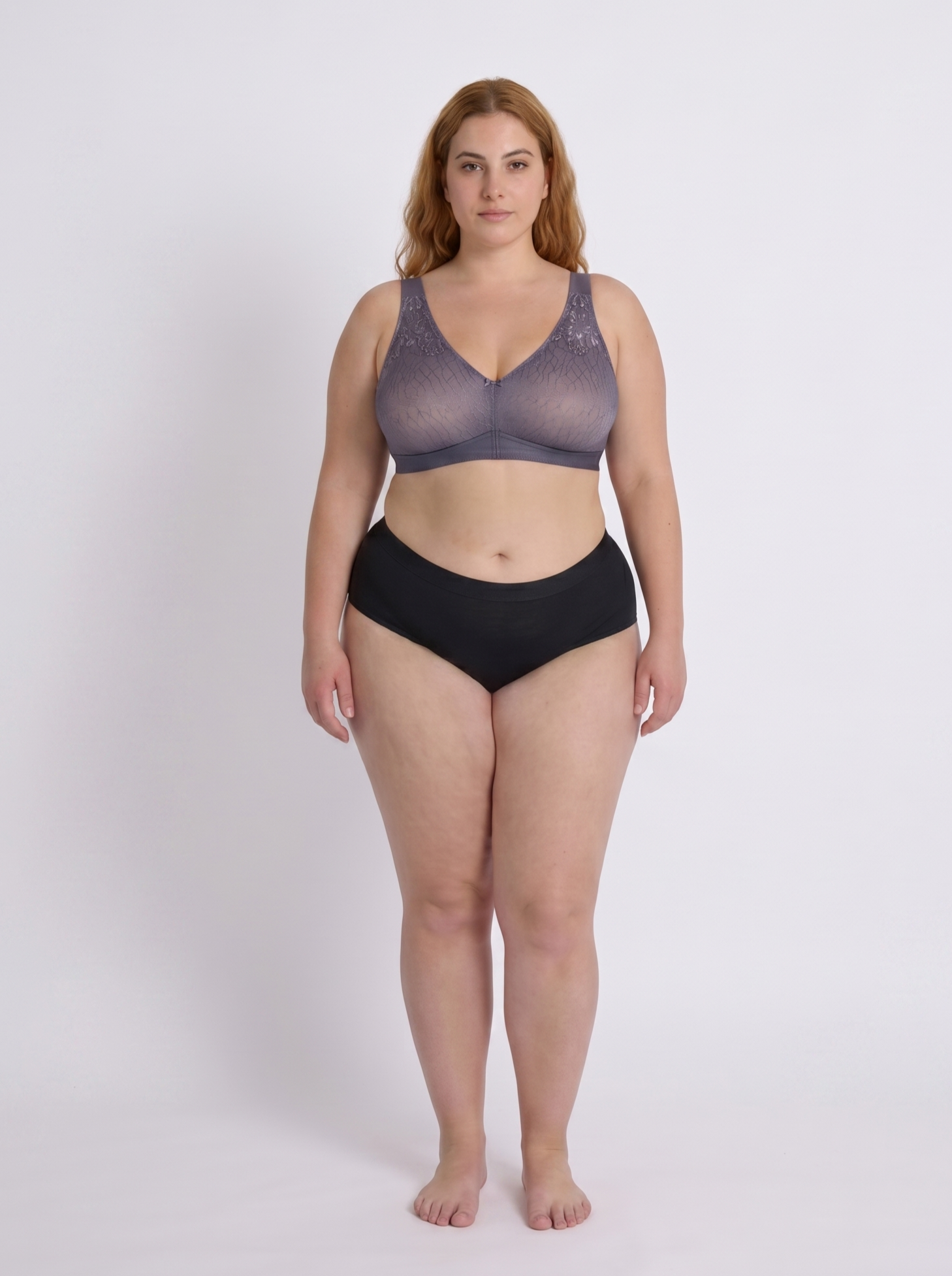 Woman wearing a purple-grey supportive wireless bra for large bust full body front view