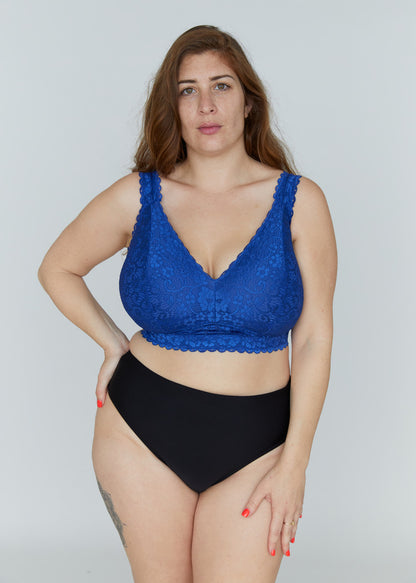Front portrait view of the royal blue Kimi lace bra for large breasts on a model, showcasing the elegant lace neckline, comfortable wire-free support, and wide band