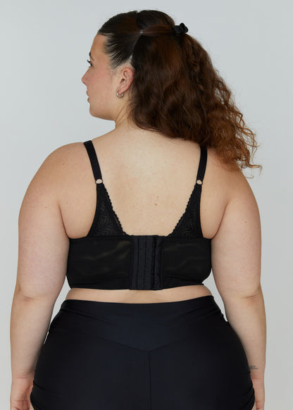 The supportive back view of a black Mia wire-free lace bra for large breasts, showing wide adjustable straps and back closure