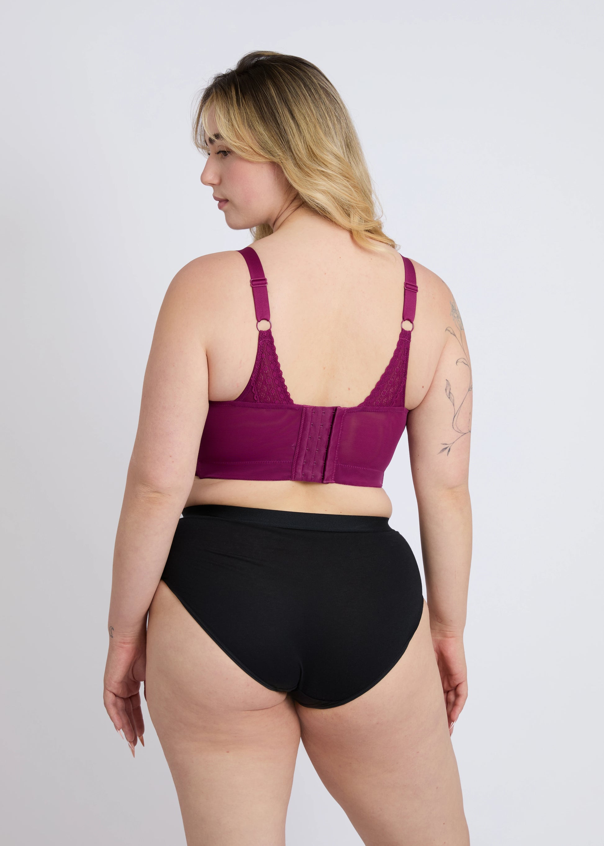 Back view of the Mia purple wire-free lace bra for large breasts, showing supportive back straps and hook-and-eye closure