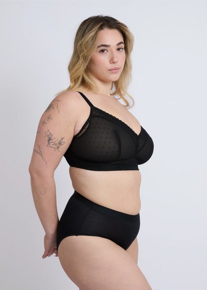 Side profile view of the NewG Alma black wireless bra for large busts, showing the lace trim detailing and smooth side support for a comfortable fit.