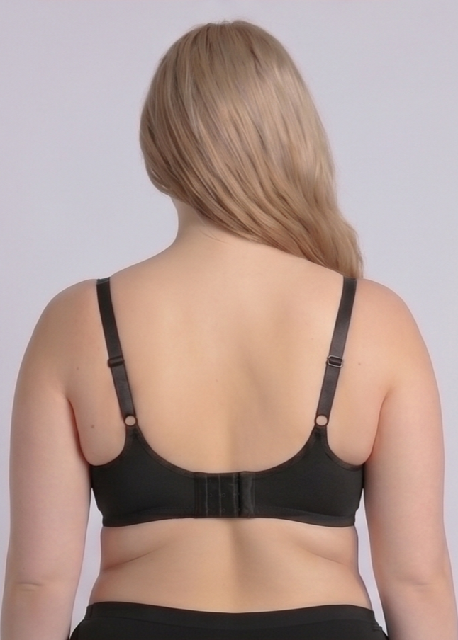 Rear view of the NewG Bella black underwire minimizer bra for large busts, highlighting the wide adjustable straps and supportive U-shaped back design on a plus-size model.