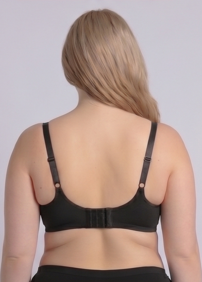 Rear view of the NewG Bella black underwire minimizer bra for large busts, highlighting the wide adjustable straps and supportive U-shaped back design on a plus-size model.