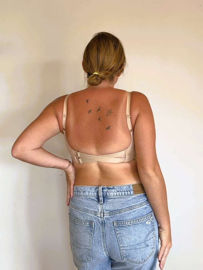 Rear view of the NewG Doni beige wireless bra for large busts, featuring a low back criss-cross strap design and comfortable lifestyle fit.