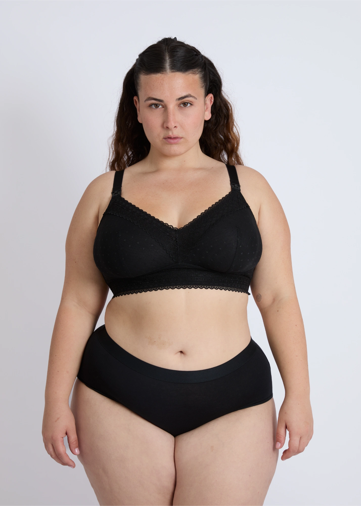 Front view of a black open-back nursing bra for large bust providing support and style