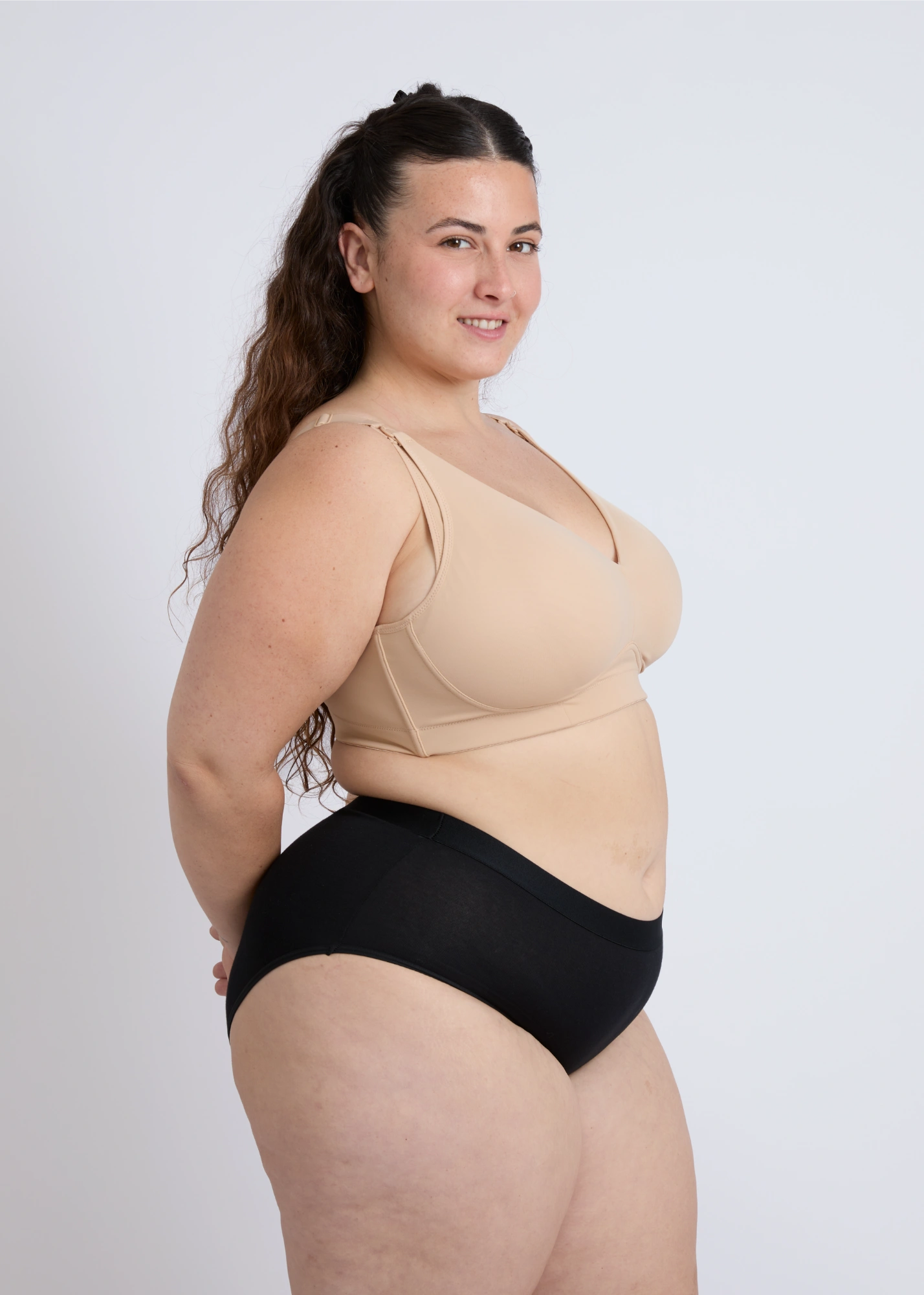 Side view of a supportive open back nursing bra for large breasts showing the comfortable fit