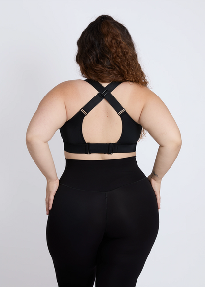 Supportive criss-cross back design of a black sports bra for big breasts