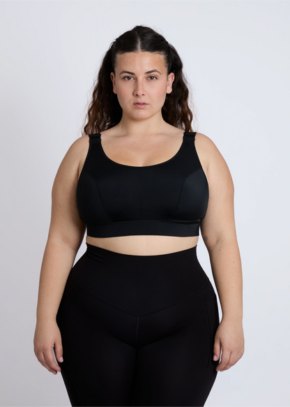 Front view of a supportive black sports bra for big breasts offering high-impact control