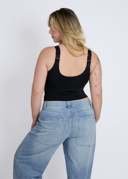 The sleek back view of a black supportive tank top for large breasts with a built-in bra providing full coverage